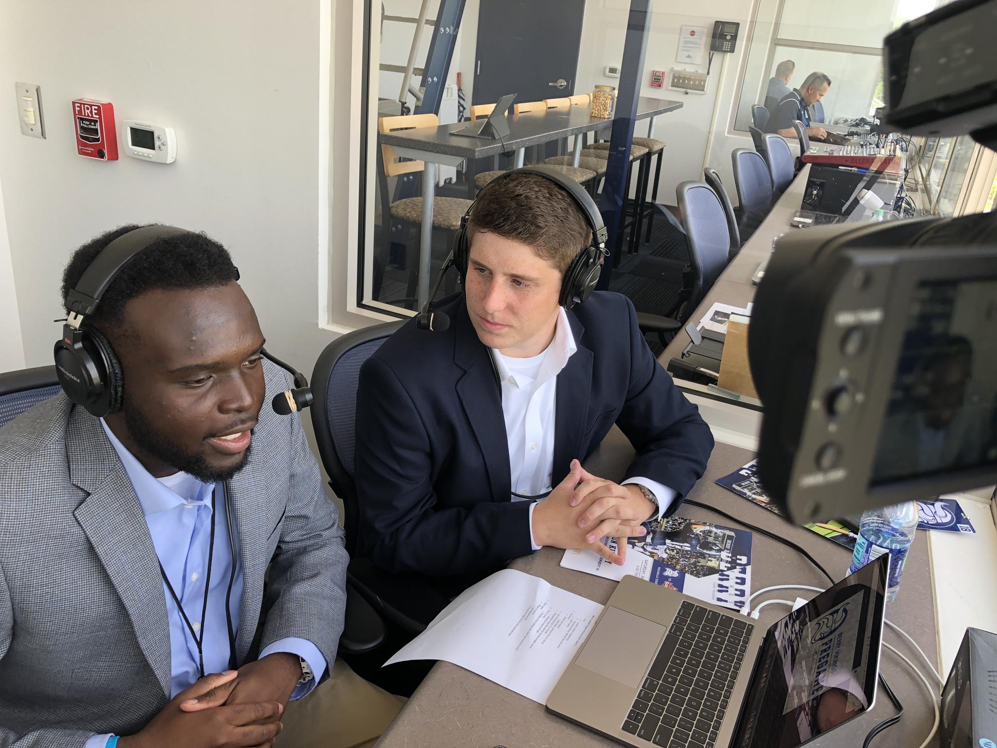 Announcing a Berry College football game as an undergraduate with his classmate Bryce Koon.